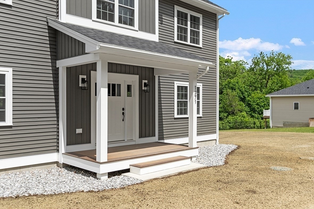 1371 South Athol Road Athol, MA 01331 - Photo 2 of 39 a front view of a house with a yard
