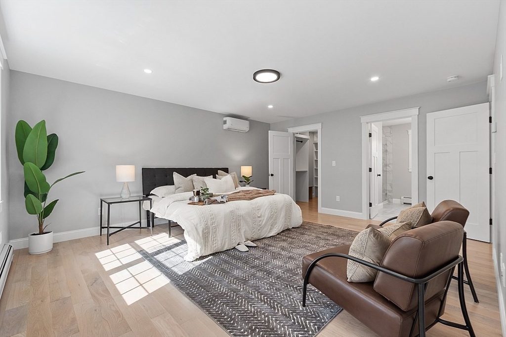 1371 South Athol Road Athol, MA 01331 - Photo 21 of 39 a spacious bedroom with a bed and a couch