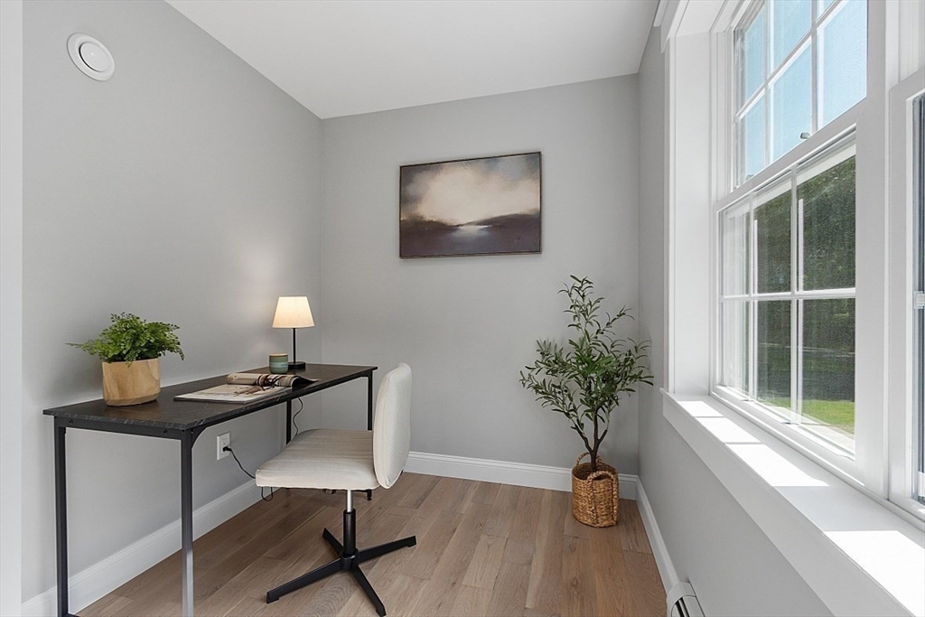 1371 South Athol Road Athol, MA 01331 - Photo 24 of 39 a view of a workspace with furniture and a potted plant