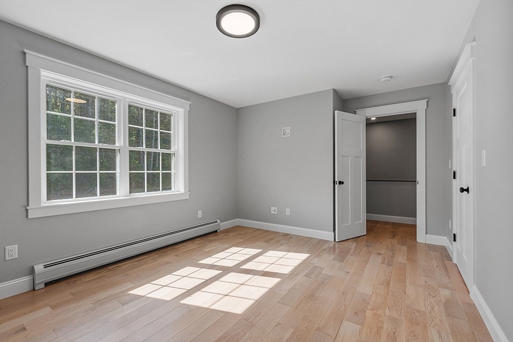 1371 South Athol Road Athol, MA 01331 - Photo 30 of 39 an empty room with wooden floor and windows