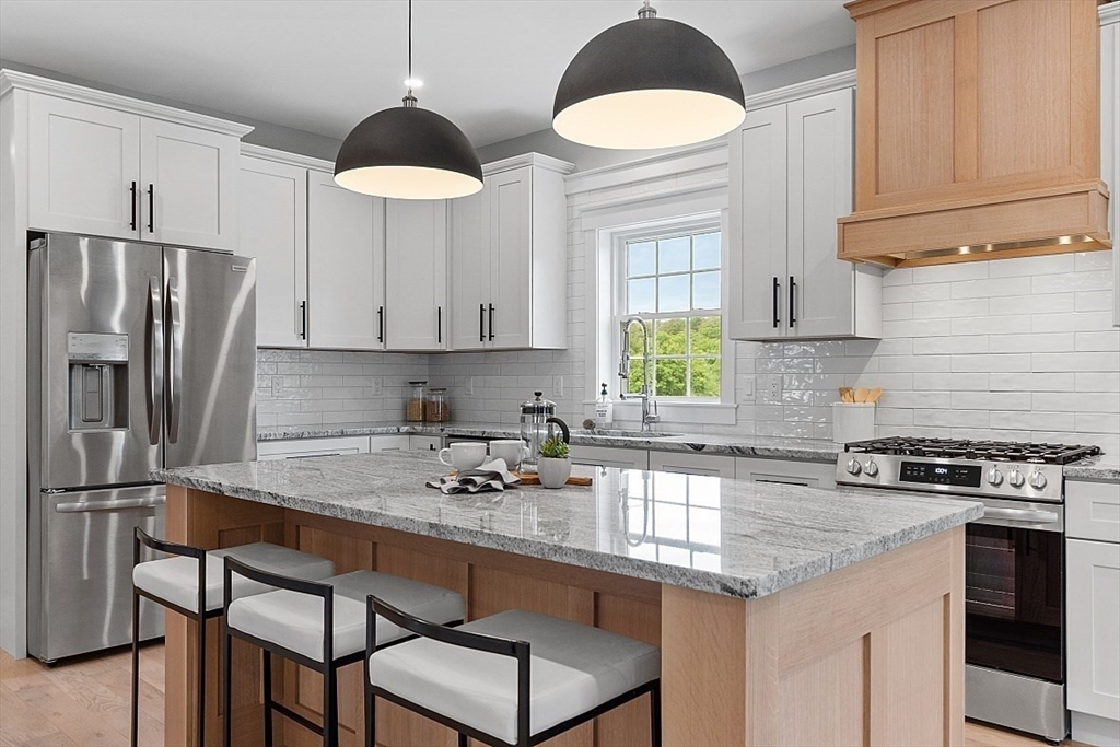 1371 South Athol Road Athol, MA 01331 - Photo 6 of 39 a kitchen with stainless steel appliances granite countertop a stove a sink refrigerator and cabinets