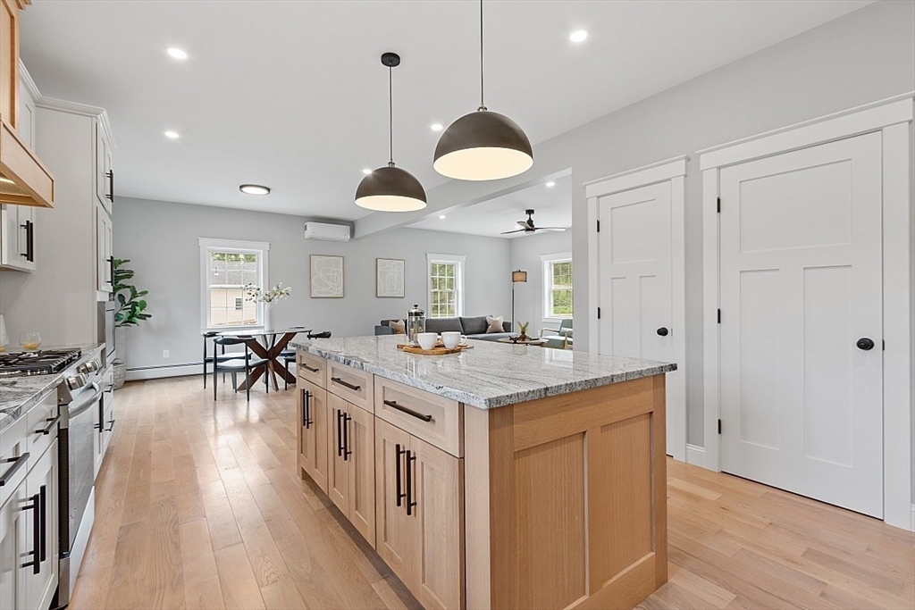 1371 South Athol Road Athol, MA 01331 - Photo 9 of 39 a kitchen with lots of counter space and wooden floor