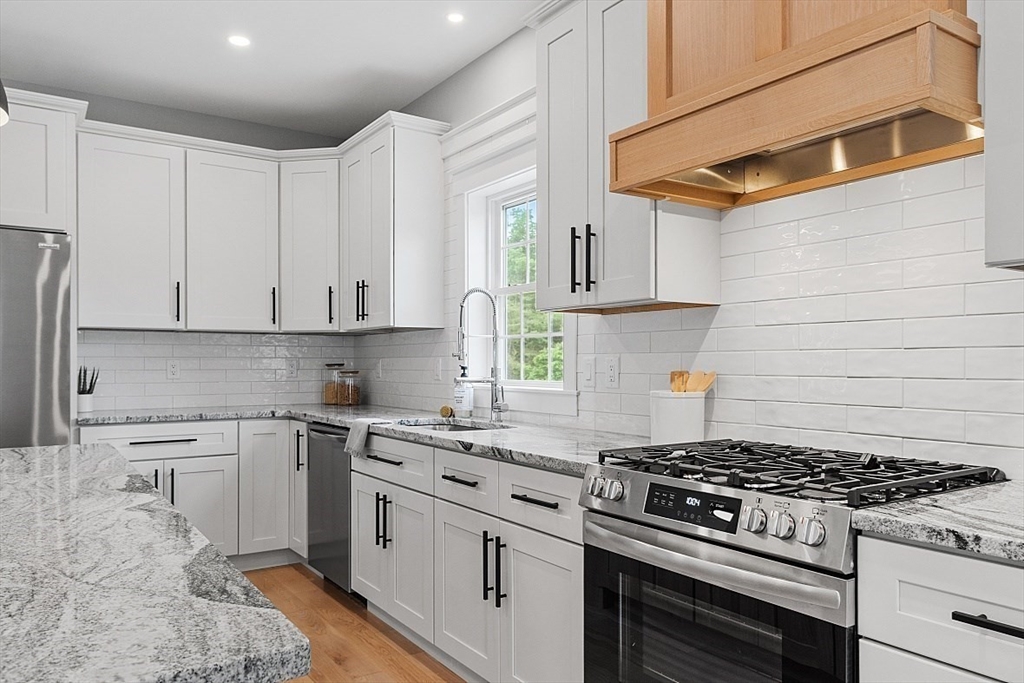 1371 South Athol Road Athol, MA 01331 - Photo 10 of 39 a kitchen with white cabinets and appliances