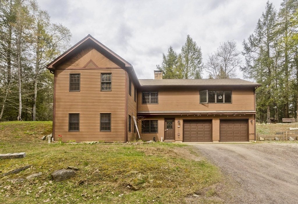 55 Cummington Road Chesterfield, MA 01084 - Photo 2 of 41 a front view of a house with garden