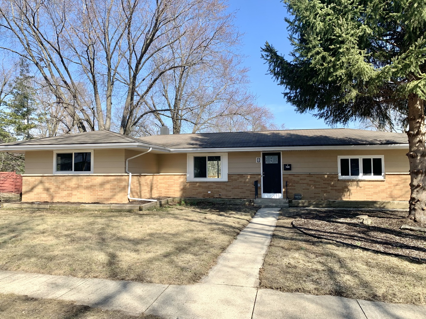1500 Evergreen Street St. Charles, IL 60174 - Photo 1 of 34 a front view of a house with a yard