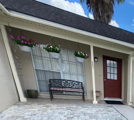 a bench sitting in front of a door