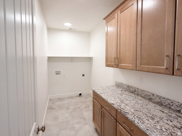 1251 North 2525 West Clinton, UT 84015 - Photo 24 of 30 Utility room featuring light wood-finish cabinetry, a granite-patterned countertop, and neutral tile flooring