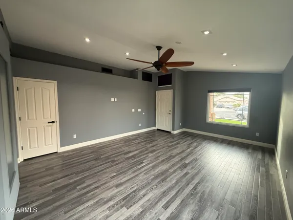 a view of an empty room and a window