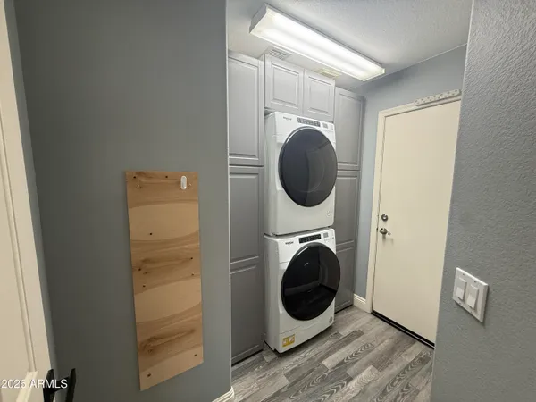 a view of a hallway with washer and dryer