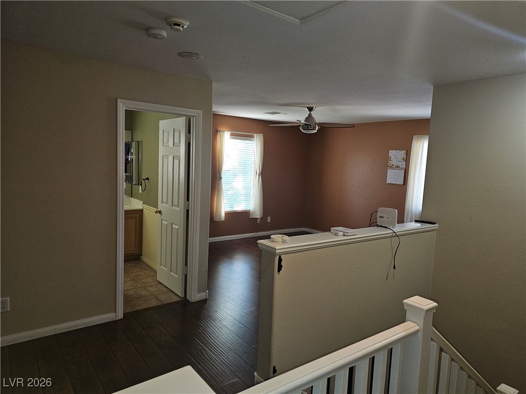 11081 Village Ridge Lane Las Vegas, NV 89135 - Photo 18 of 18 Hall featuring an upstairs landing and dark wood-type flooring