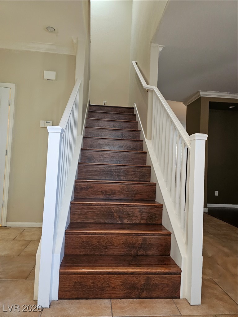 11081 Village Ridge Lane Las Vegas, NV 89135 - Photo 10 of 18 Stairs with ornamental molding and baseboards