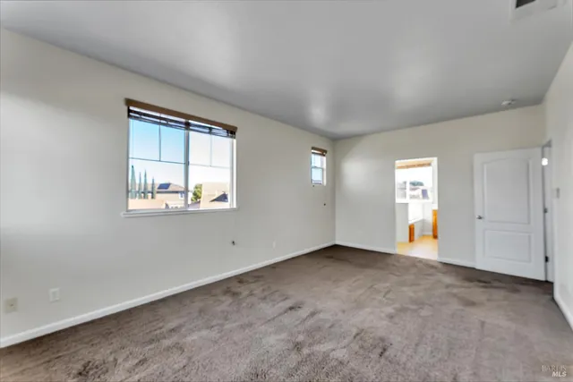 an empty room with windows