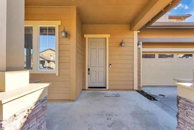 a view of an entryway with wooden floor