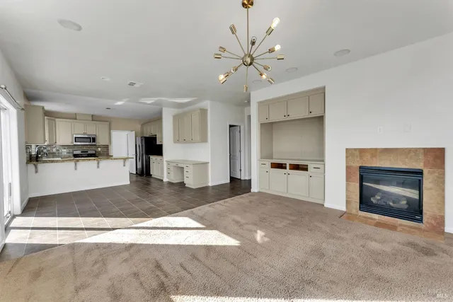 a view of a kitchen with a sink and a stove top oven