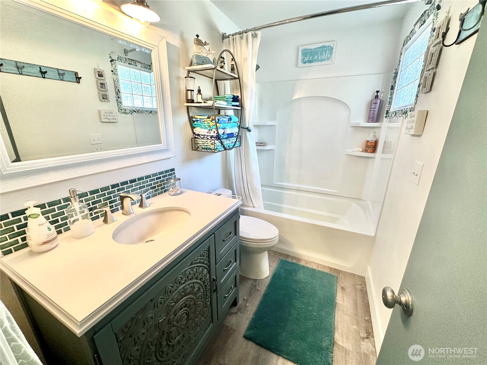 15217 Pacific Way Long Beach, WA 98631 - Photo 13 of 40 a bathroom with a sink a toilet and shower
