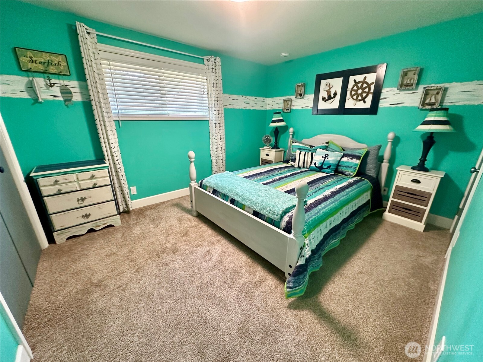 15217 Pacific Way Long Beach, WA 98631 - Photo 15 of 40 a bedroom with a bed and windows