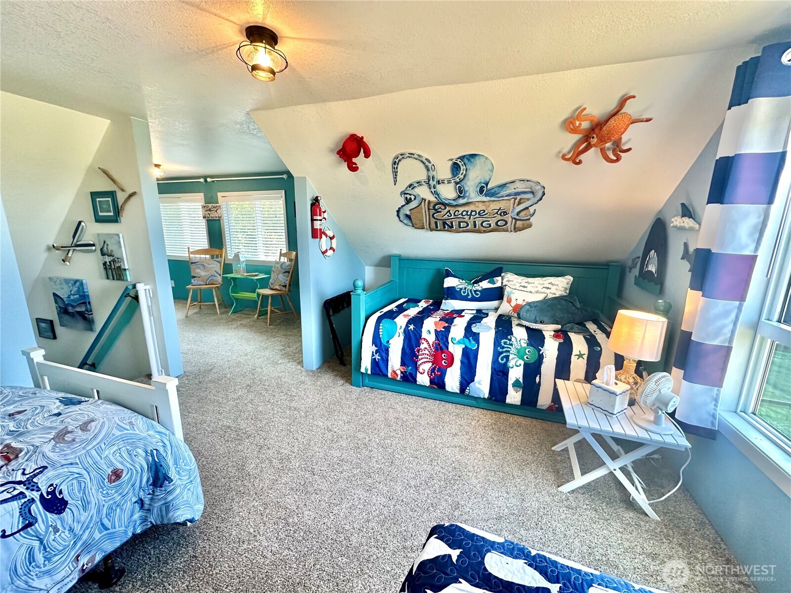 15217 Pacific Way Long Beach, WA 98631 - Photo 17 of 40 a bedroom with a bed and a table