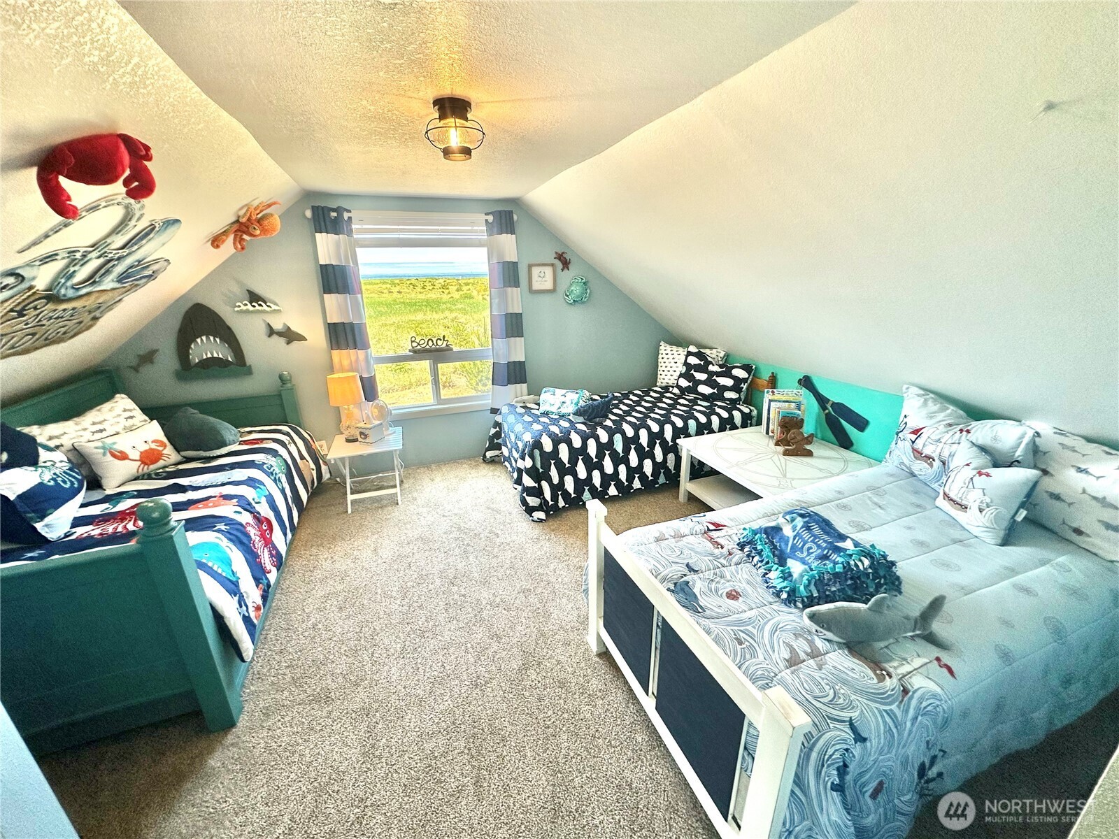 15217 Pacific Way Long Beach, WA 98631 - Photo 18 of 40 a living room with furniture and a large window