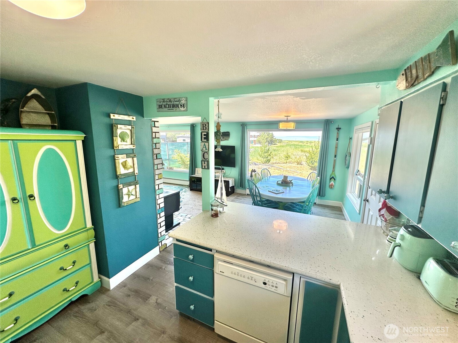 15217 Pacific Way Long Beach, WA 98631 - Photo 10 of 40 a room with painting on the wall mirror and a window