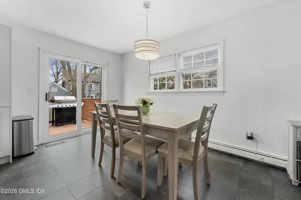a view of a dining room with furniture window and outside view