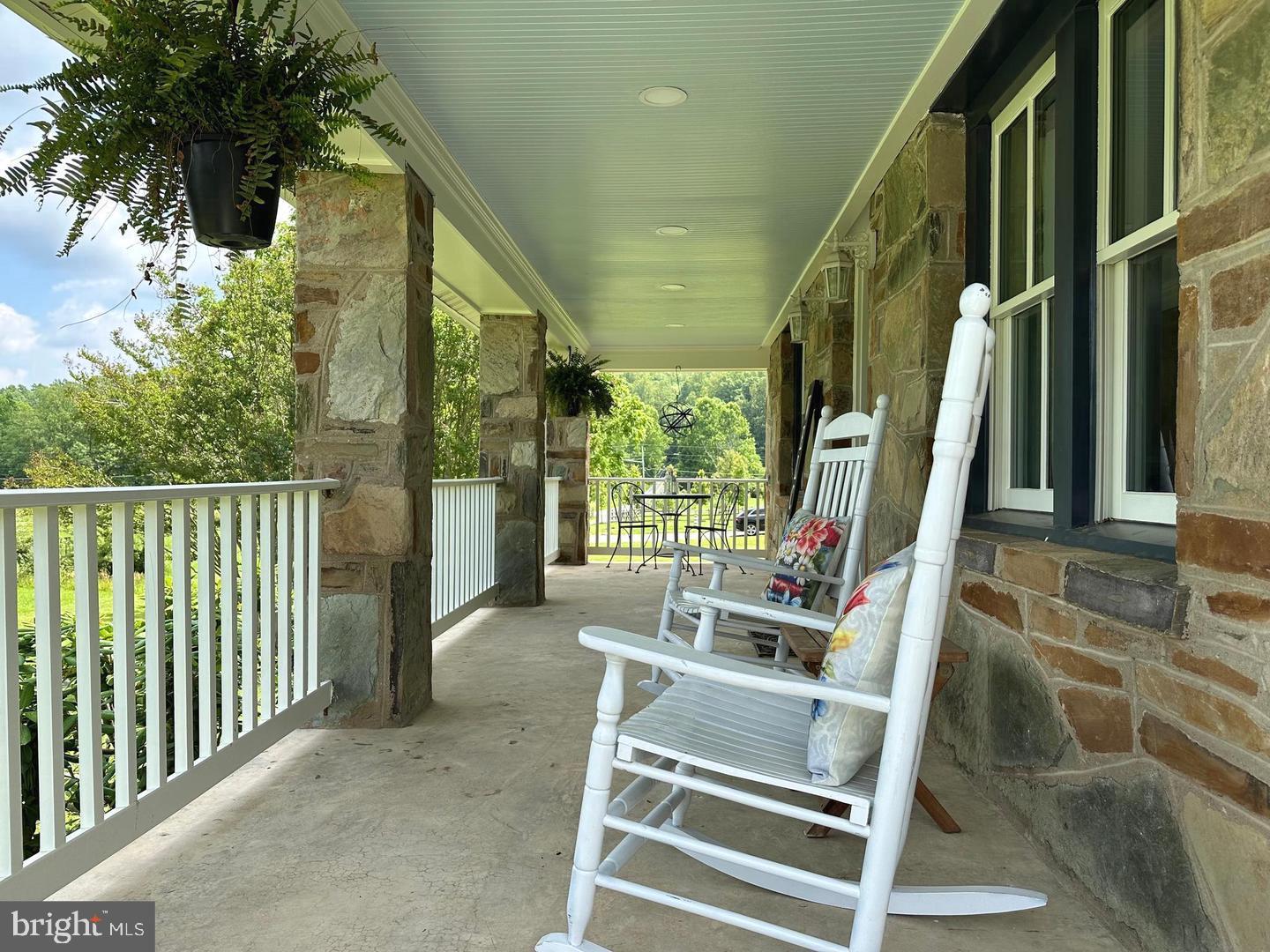 12301 Chapel Road Clifton, VA 20124 - Photo 2 of 3 Charming porch with serene views.