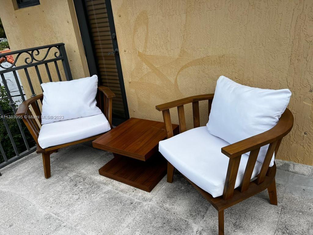 1411 Normandy Drive Miami Beach, FL 33141 - Photo 12 of 23 a living room with furniture and a rug