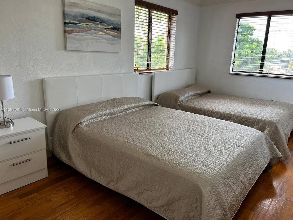 1411 Normandy Drive Miami Beach, FL 33141 - Photo 14 of 23 a bedroom with a bed and a window