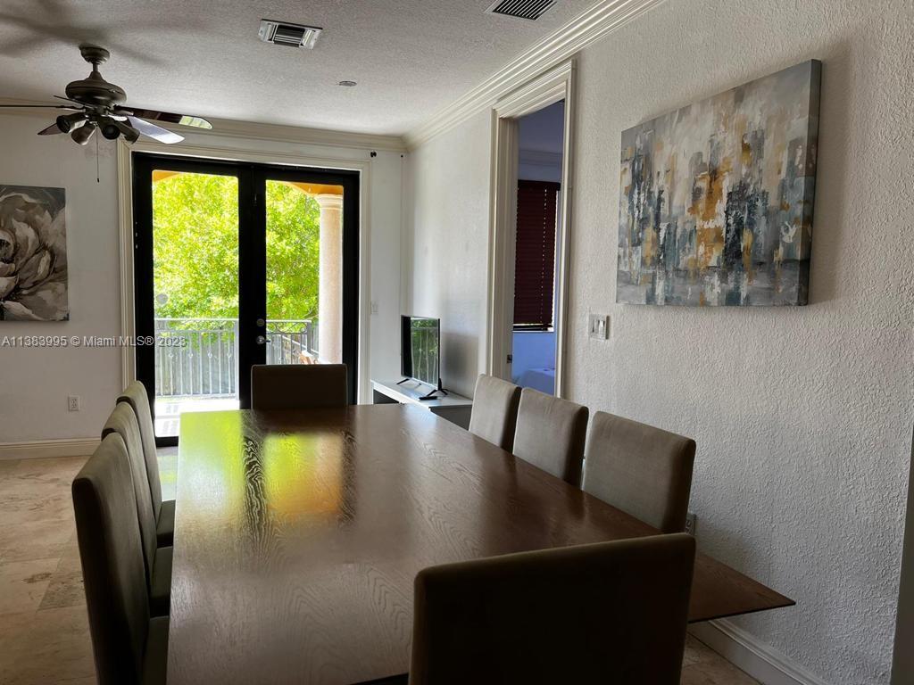 1411 Normandy Drive Miami Beach, FL 33141 - Photo 7 of 23 a view of a dining room with furniture window and outside view