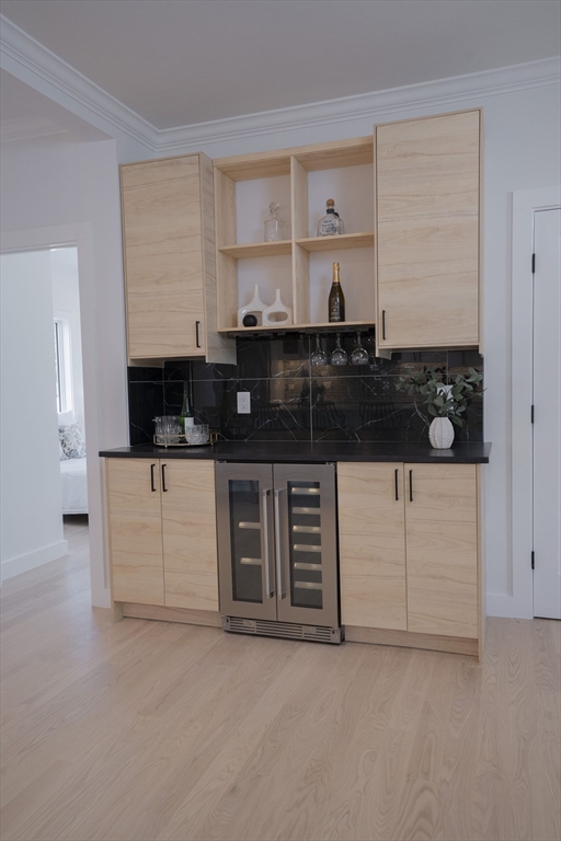 24 Palmetto Street Saugus, MA 01906 - Photo 16 of 37 a kitchen with stainless steel appliances granite countertop a stove a sink and a microwave