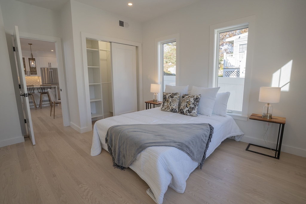 24 Palmetto Street Saugus, MA 01906 - Photo 17 of 37 a bedroom with a bed and a mirror