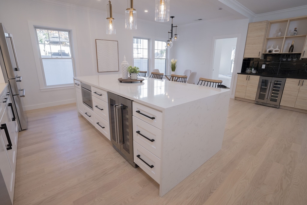 24 Palmetto Street Saugus, MA 01906 - Photo 18 of 37 a kitchen with stainless steel appliances a sink stove and cabinets