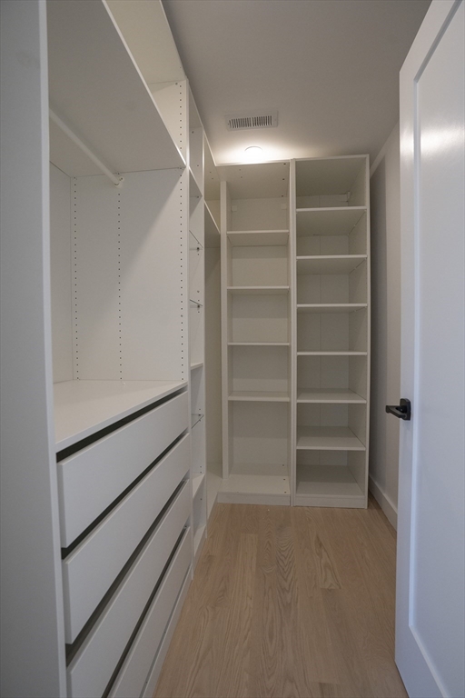 24 Palmetto Street Saugus, MA 01906 - Photo 26 of 37 a view of walk in closet with empty racks