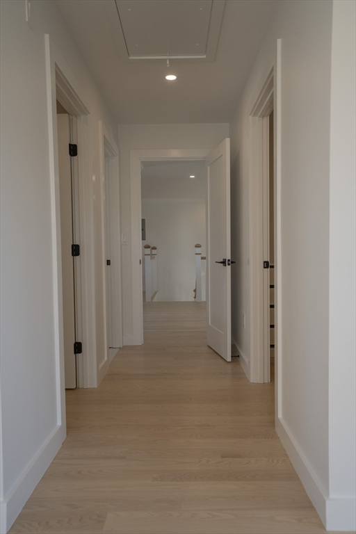 24 Palmetto Street Saugus, MA 01906 - Photo 27 of 37 a view of a hallway with wooden shelves