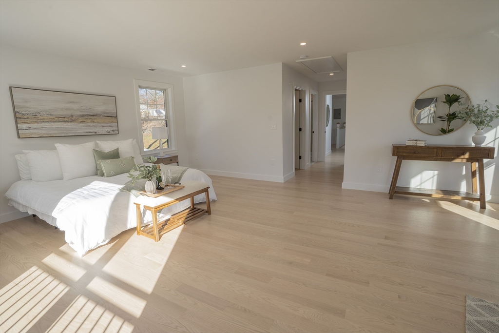 24 Palmetto Street Saugus, MA 01906 - Photo 28 of 37 a bedroom with a bed and painting on the wall