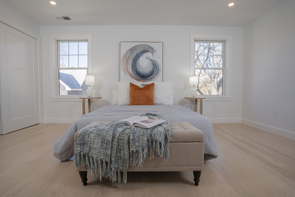 24 Palmetto Street Saugus, MA 01906 - Photo 30 of 37 a bedroom with a bed window and mirror