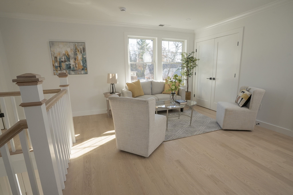 24 Palmetto Street Saugus, MA 01906 - Photo 33 of 37 a living room with furniture and a large window
