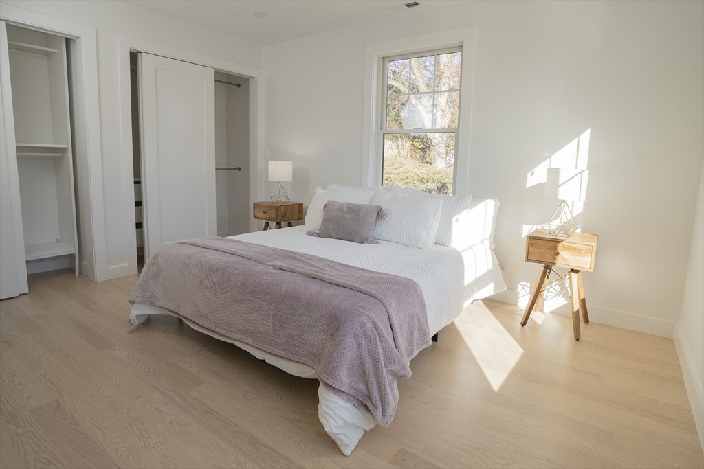 24 Palmetto Street Saugus, MA 01906 - Photo 35 of 37 a bedroom with a bed and a window