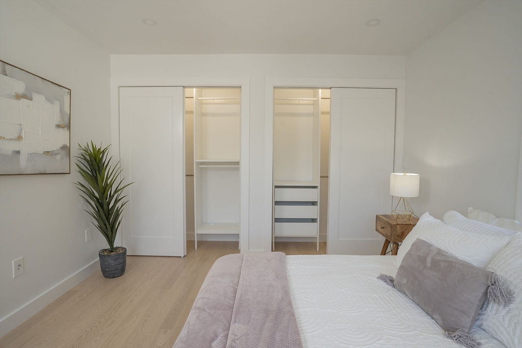 24 Palmetto Street Saugus, MA 01906 - Photo 36 of 37 a bedroom with furniture and a potted plant