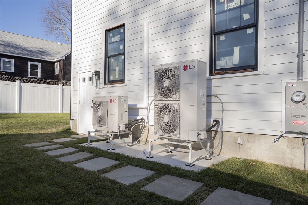 24 Palmetto Street Saugus, MA 01906 - Photo 4 of 37 a backyard of a house with table and chairs