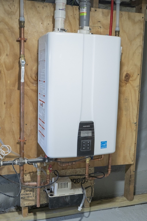 24 Palmetto Street Saugus, MA 01906 - Photo 9 of 37 a picture of water heater room