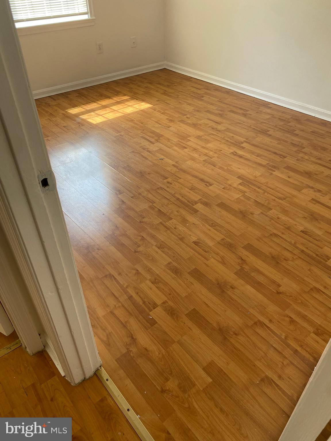 9717 Whiskey Run Laurel, MD 20723 - Photo 12 of 31 a view of empty room with wooden floor