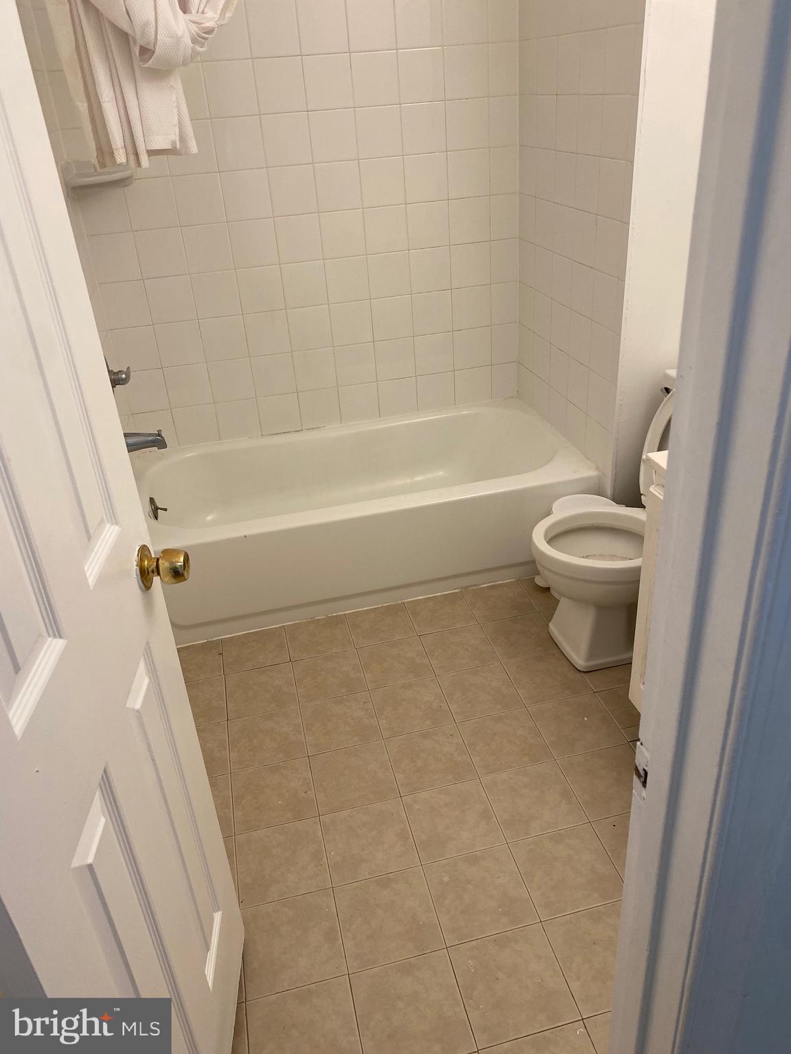 9717 Whiskey Run Laurel, MD 20723 - Photo 17 of 31 a bathroom with a toilet and a shower