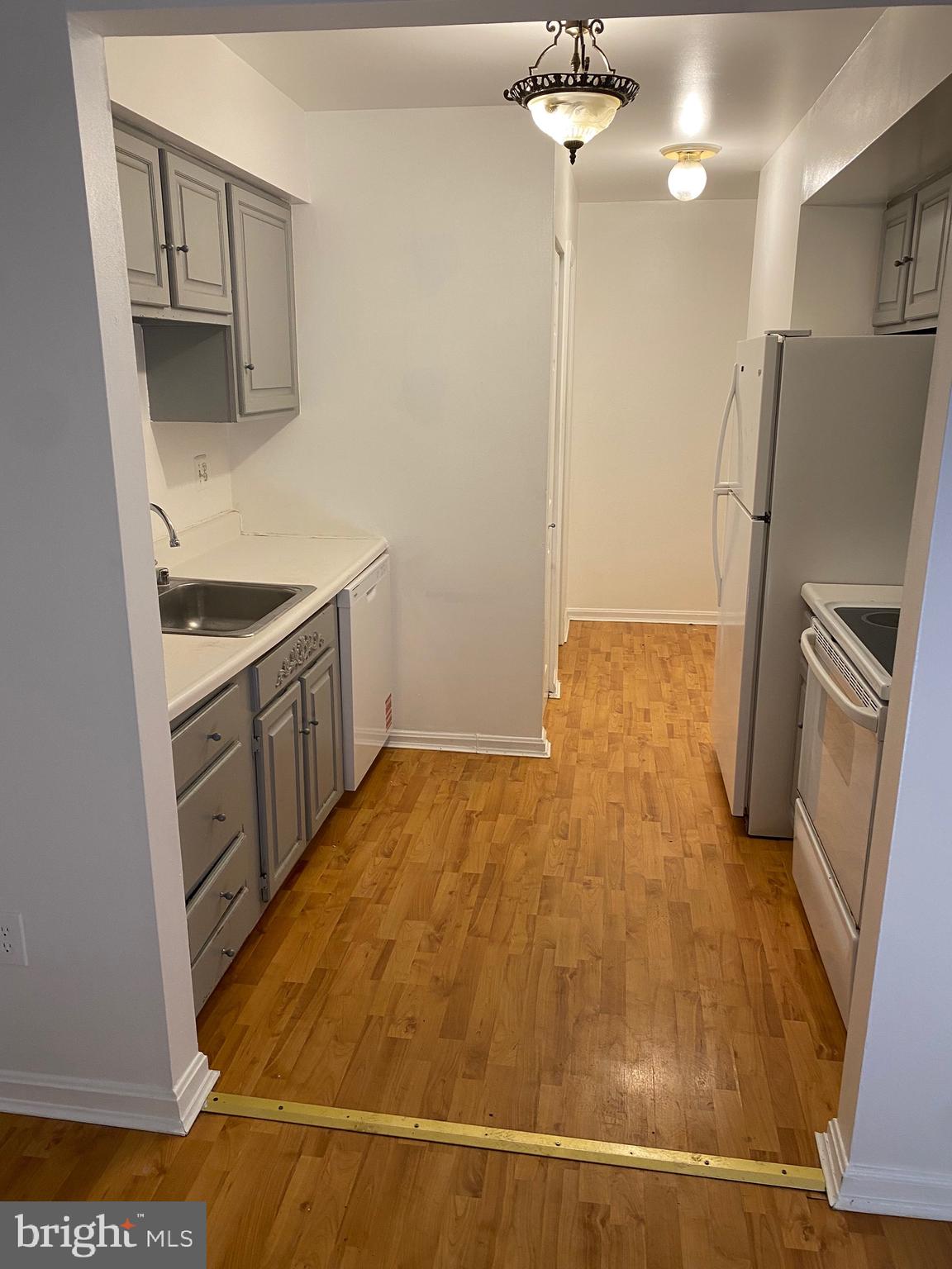 9717 Whiskey Run Laurel, MD 20723 - Photo 3 of 31 a kitchen with stainless steel appliances a refrigerator and a stove