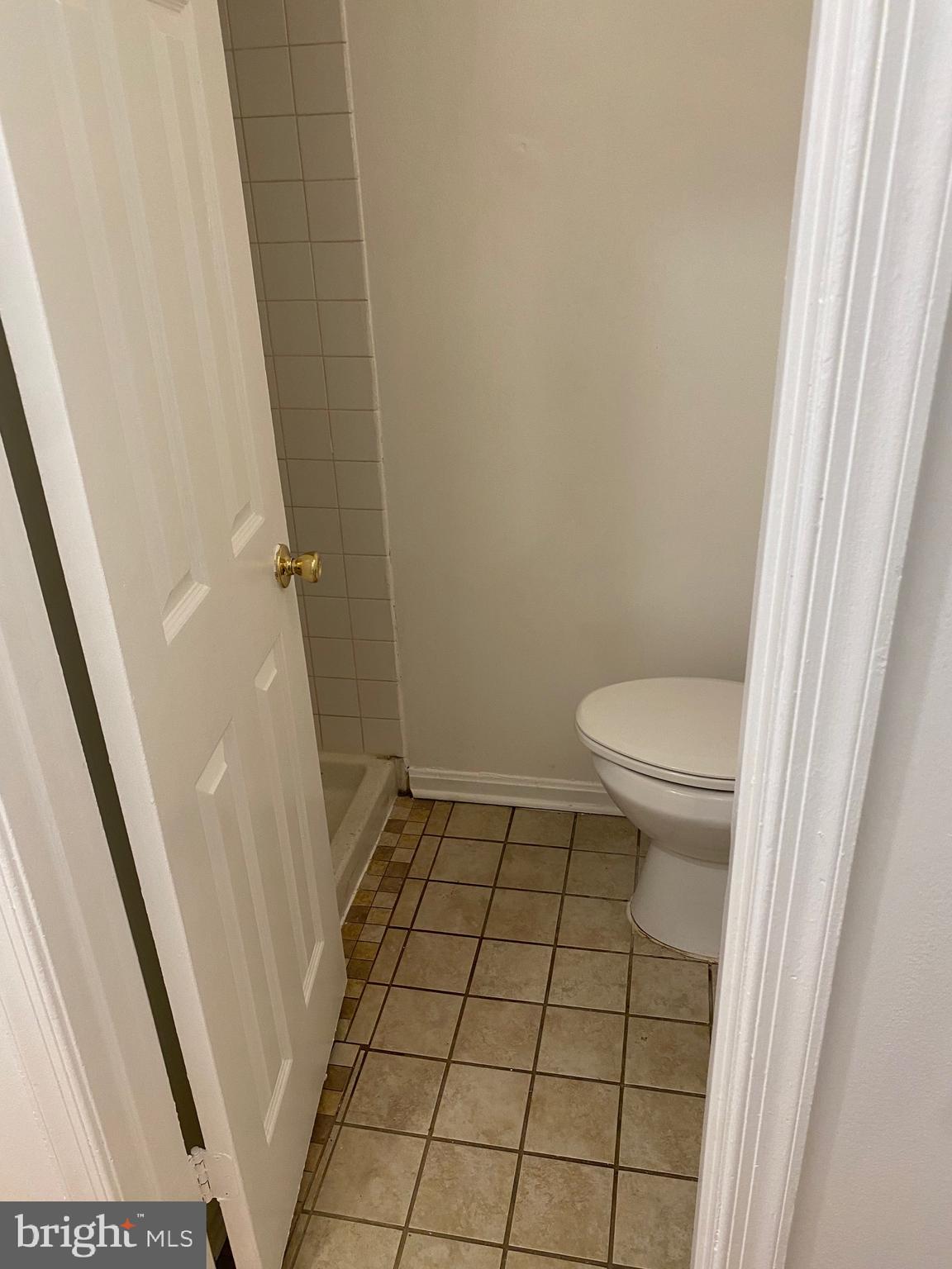 9717 Whiskey Run Laurel, MD 20723 - Photo 7 of 31 a bathroom with a sink and a shower