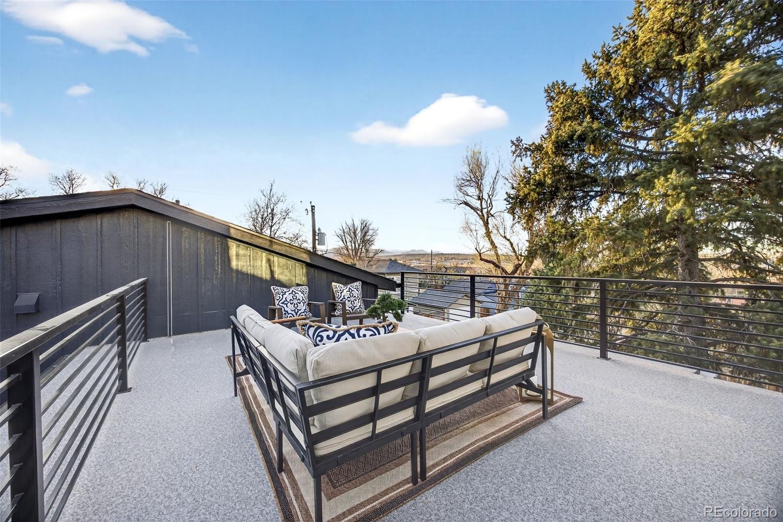 5175 Raleigh Street Denver, CO 80212 - Photo 28 of 49 a roof deck with couches and wooden fence