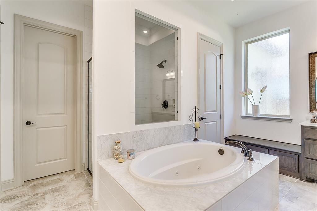 1636 Prairie Ridge Road Fort Worth, TX 76008 - Photo 11 of 14 a bathroom with a tub sink and mirror