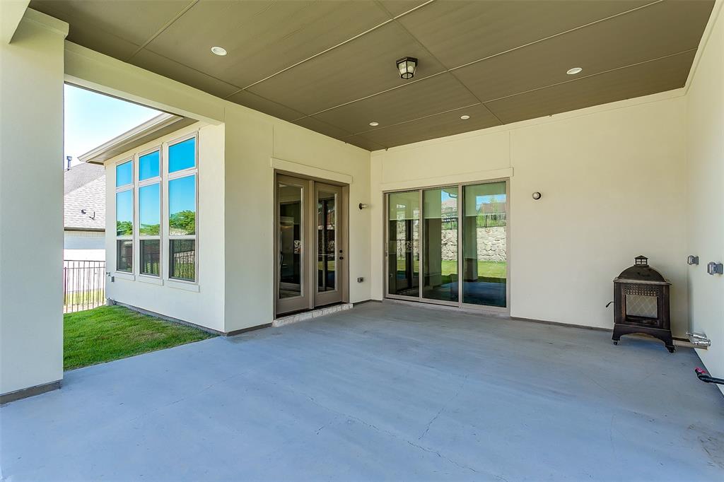 1636 Prairie Ridge Road Fort Worth, TX 76008 - Photo 14 of 14 a view of an empty room with glass door and balcony