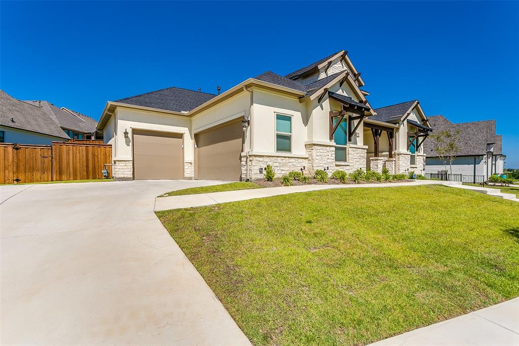 1636 Prairie Ridge Road Fort Worth, TX 76008 - Photo 2 of 14 a view of a house with a swimming pool