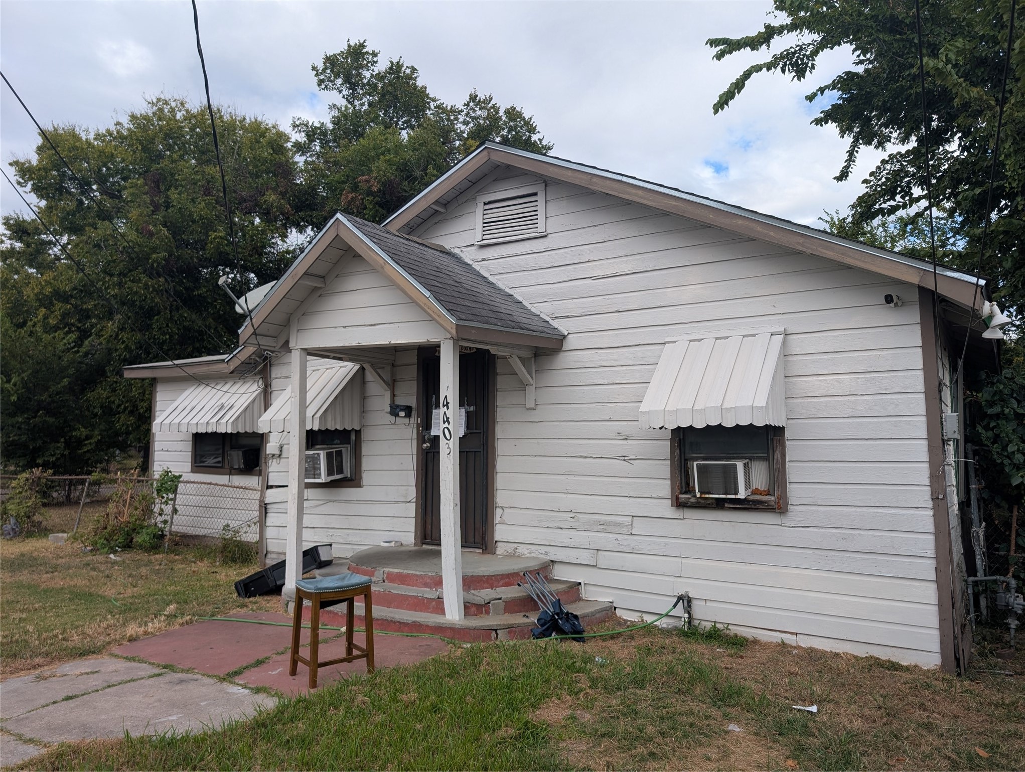 a front view of house with yard and outdoor seating