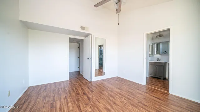 a view of a kitchen and wooden floor